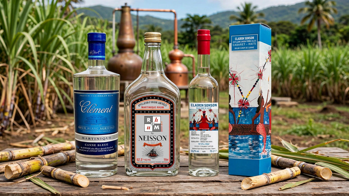 Clement Canne Bleue, Neisson Rhum Blanc 105 and Clairin Sonson bottles with sugarcane stalks and a copper still in Martinique at Del Mesa Liquor