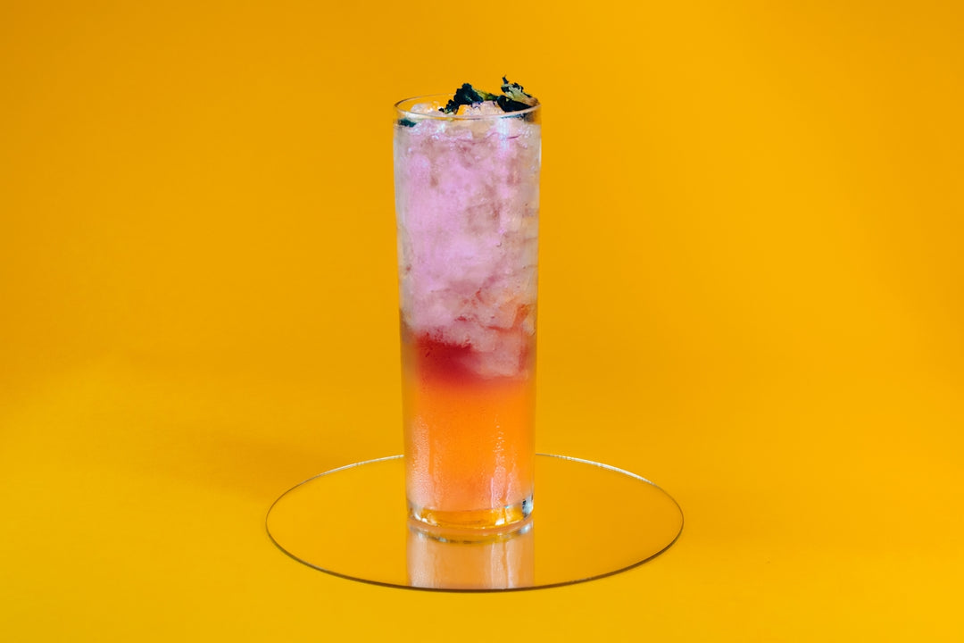 a glass with a drink in it