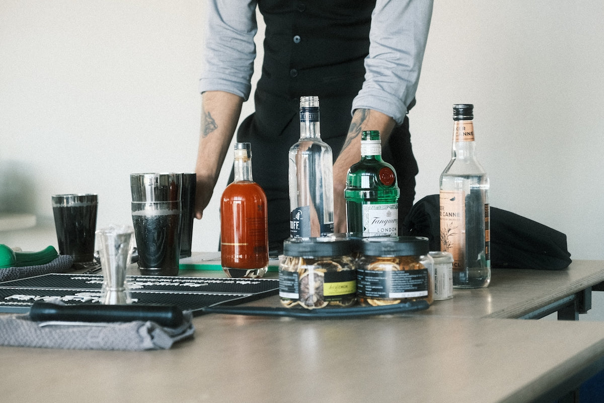 a table with bottles and glasses