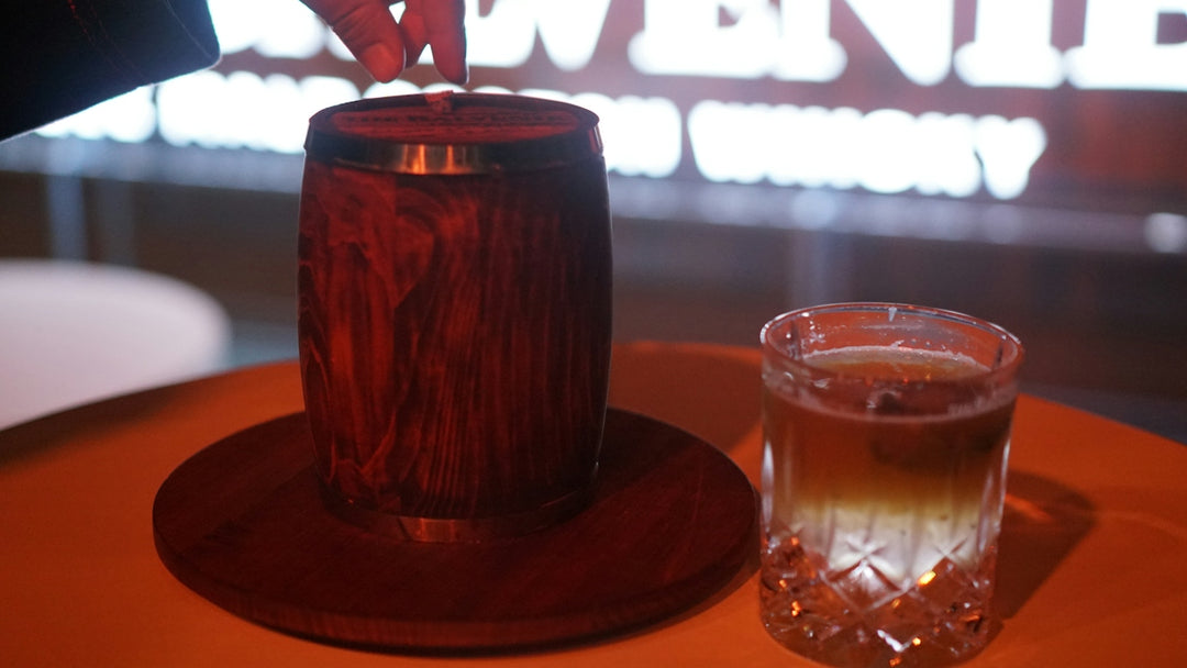 a glass of liquid sitting on top of a table